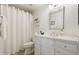 Well-lit bathroom with a decorative mirror, white cabinets and drawers, plus shower and bath tub at 20100 N 78Th Pl # 1040, Scottsdale, AZ 85255