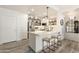 Modern kitchen with stainless steel appliances, white cabinets, and island with seating for casual dining at 20100 N 78Th Pl # 1040, Scottsdale, AZ 85255
