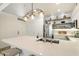 Bright kitchen with stainless steel appliances, white cabinets and countertops, and stylish light fixture at 20100 N 78Th Pl # 1040, Scottsdale, AZ 85255