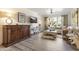 Inviting living room with wood-look flooring, plush seating, neutral decor, TV and view to the outside at 20100 N 78Th Pl # 1040, Scottsdale, AZ 85255