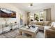 Bright living room featuring neutral decor, plush seating, and lots of light from the large windows at 20100 N 78Th Pl # 1040, Scottsdale, AZ 85255