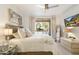 Relaxing bedroom with soft bedding, natural light from the sliding door, and a TV for entertainment at 20100 N 78Th Pl # 1040, Scottsdale, AZ 85255
