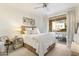 Inviting bedroom with a cozy bed, soft lighting, and a sliding door with access to an outdoor space at 20100 N 78Th Pl # 1040, Scottsdale, AZ 85255