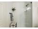 Stylish white-tiled shower with glass door, decorative accents, and modern fixtures and hardware at 20100 N 78Th Pl # 1040, Scottsdale, AZ 85255