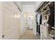 Well-organized walk-in closet flows into a bathroom with seamless transition and functional design at 20100 N 78Th Pl # 1040, Scottsdale, AZ 85255