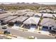 An aerial shot of a modern neighborhood featuring desert landscaping, sidewalks, and residential homes at 2027 W Sleepy Ranch Rd, Phoenix, AZ 85085