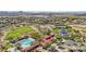 Stunning aerial view of community clubhouse, pool, tennis courts, and surrounding neighborhood at 2027 W Sleepy Ranch Rd, Phoenix, AZ 85085