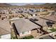Expansive aerial view of a residential community showcasing well-maintained homes and desert landscaping at 2027 W Sleepy Ranch Rd, Phoenix, AZ 85085