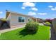 Low-maintenance backyard with pavers, artificial grass, and lush plants for easy outdoor enjoyment at 2027 W Sleepy Ranch Rd, Phoenix, AZ 85085