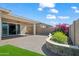 Well-maintained backyard with paver patio, artificial grass, and vibrant landscaping at 2027 W Sleepy Ranch Rd, Phoenix, AZ 85085