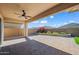 Enjoy outdoor living on this beautiful paver patio with lush landscaping and clear blue skies at 2027 W Sleepy Ranch Rd, Phoenix, AZ 85085
