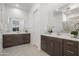 Bright bathroom featuring dual vanities, modern fixtures, and neutral tile flooring at 2027 W Sleepy Ranch Rd, Phoenix, AZ 85085