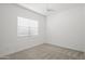 Bedroom with neutral carpet, bright white walls, ceiling fan and large window at 2027 W Sleepy Ranch Rd, Phoenix, AZ 85085