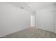 Bright bedroom featuring neutral carpet, ceiling fan and a closet with sliding doors at 2027 W Sleepy Ranch Rd, Phoenix, AZ 85085