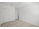 Bright bedroom featuring neutral carpet, ceiling fan and a closet with sliding doors at 2027 W Sleepy Ranch Rd, Phoenix, AZ 85085