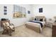 Comfortable bedroom with neutral carpet, a large window, and stylish furnishings at 2027 W Sleepy Ranch Rd, Phoenix, AZ 85085