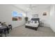 Cozy bedroom with a large window, carpeted floors, and a comfortable bed at 2027 W Sleepy Ranch Rd, Phoenix, AZ 85085