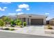 Charming single-story home with stone accents, a two-car garage, and manicured landscaping at 2027 W Sleepy Ranch Rd, Phoenix, AZ 85085