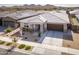 Stunning aerial view of single-Gathering home featuring a spacious driveway and desert landscaping at 2027 W Sleepy Ranch Rd, Phoenix, AZ 85085