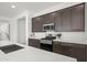 Well-equipped kitchen featuring stainless steel appliances, stone countertops, and ample cabinet space at 2027 W Sleepy Ranch Rd, Phoenix, AZ 85085