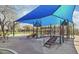 Community playground with a covered play area, slides, and climbing structures at 2027 W Sleepy Ranch Rd, Phoenix, AZ 85085