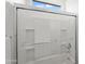 White tile shower with a glass sliding door, recessed shelves and a shower bar at 2027 W Sleepy Ranch Rd, Phoenix, AZ 85085