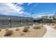 Well-maintained tennis courts surrounded by a secure fence for an active lifestyle at 2027 W Sleepy Ranch Rd, Phoenix, AZ 85085