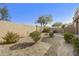 Private backyard features desert landscaping, decorative fountain and stone walkway at 20750 N 87Th St # 1009, Scottsdale, AZ 85255