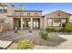 Covered back patio with desert landscaping and decorative stone walkway at 20750 N 87Th St # 1009, Scottsdale, AZ 85255