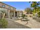 Backyard showcases a decorative fountain, desert landscaping and covered patio at 20750 N 87Th St # 1009, Scottsdale, AZ 85255
