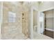 Elegant bathroom featuring a tiled shower with glass enclosure, toilet room and closet at 20750 N 87Th St # 1009, Scottsdale, AZ 85255