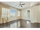 Large bedroom with hardwood floors, ceiling fan, and natural light at 20750 N 87Th St # 1009, Scottsdale, AZ 85255