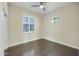 Spacious bedroom with wood floors, ceiling fan, plantation shutters, and closet at 20750 N 87Th St # 1009, Scottsdale, AZ 85255