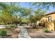 Community grounds feature mature desert landscaping, walking paths and mature trees at 20750 N 87Th St # 1009, Scottsdale, AZ 85255