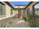 Charming front courtyard with stone pathway and arched entryway at 20750 N 87Th St # 1009, Scottsdale, AZ 85255