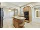 Kitchen features center island with granite countertops and stainless steel appliances at 20750 N 87Th St # 1009, Scottsdale, AZ 85255
