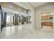 Bright living room with high ceilings, travertine flooring, and a view of the backyard at 20750 N 87Th St # 1009, Scottsdale, AZ 85255