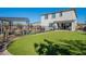 Artificial turf backyard with pergola, pool and spa at 22633 E Domingo Rd, Queen Creek, AZ 85142