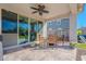 Patio with seating area, adjacent to grassy backyard at 22633 E Domingo Rd, Queen Creek, AZ 85142