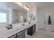 Modern bathroom boasts double vanity, large mirror, and glass shower at 22633 E Domingo Rd, Queen Creek, AZ 85142