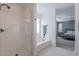 Clean bathroom with shower, bathtub, and view into bedroom at 22633 E Domingo Rd, Queen Creek, AZ 85142