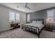 Bright bedroom with a metal bed frame and dresser at 22633 E Domingo Rd, Queen Creek, AZ 85142
