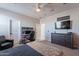Stylish bedroom with gaming setup and large TV at 22633 E Domingo Rd, Queen Creek, AZ 85142
