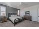 Spacious bedroom with a metal bed frame and dresser at 22633 E Domingo Rd, Queen Creek, AZ 85142