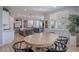 Open concept dining area and kitchen with an island at 22633 E Domingo Rd, Queen Creek, AZ 85142