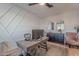 Home office with large desk, comfortable chair, and built-in shelving at 22633 E Domingo Rd, Queen Creek, AZ 85142