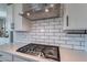 Modern kitchen features stainless steel appliances and white subway tile backsplash at 22633 E Domingo Rd, Queen Creek, AZ 85142