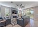 Spacious living room with fireplace and sliding doors leading to backyard at 22633 E Domingo Rd, Queen Creek, AZ 85142