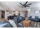 Open concept living room with a view into the kitchen at 22633 E Domingo Rd, Queen Creek, AZ 85142
