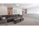 Open concept living area with sectional sofa and game board at 22633 E Domingo Rd, Queen Creek, AZ 85142